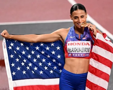 The American sprinter clocks quickest women’s 400m in 40 years to secure gold